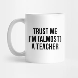 Trust me I'm (almost) a teacher. In black. Mug